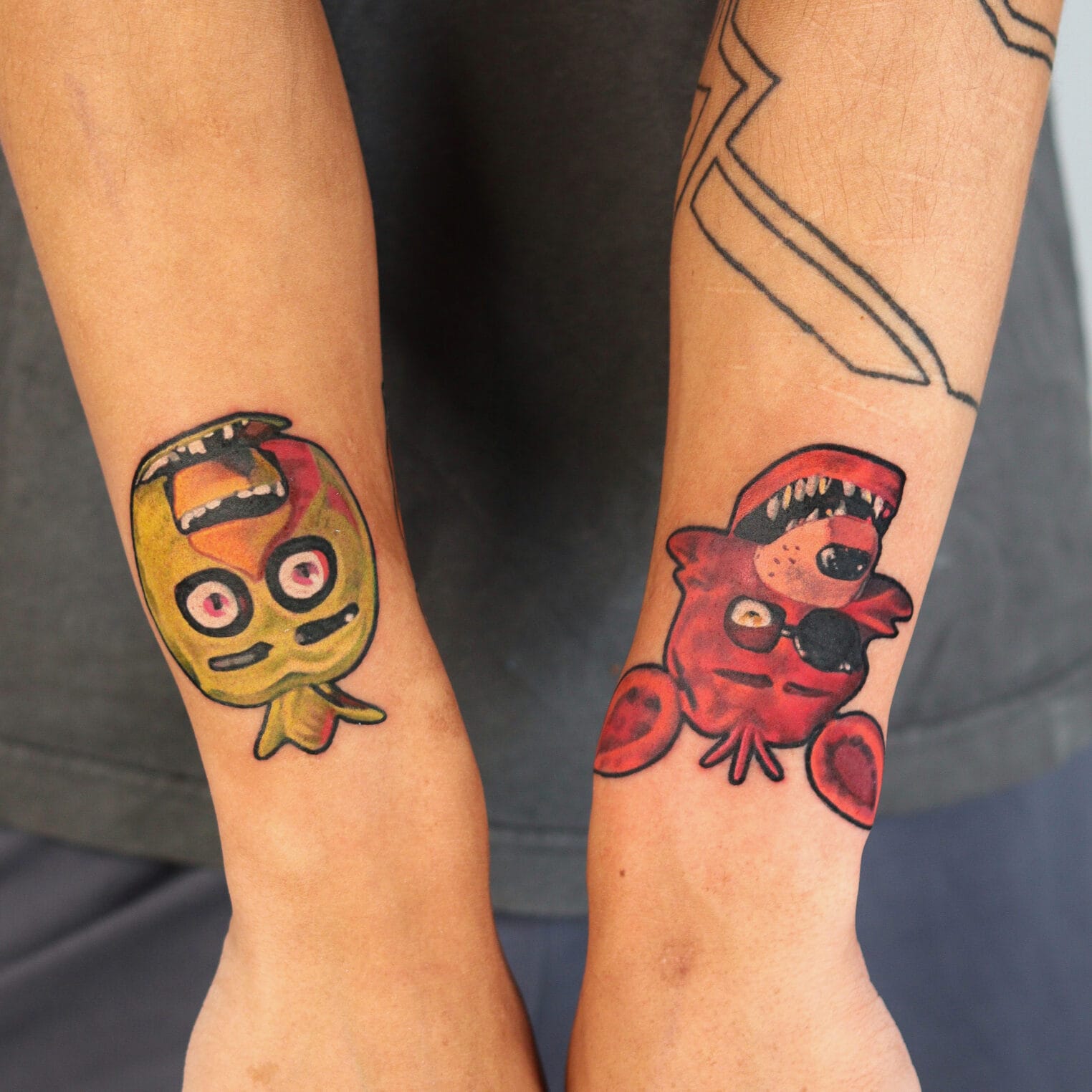 Colorful Five Nights at Freddy's Tattoos on Forearms