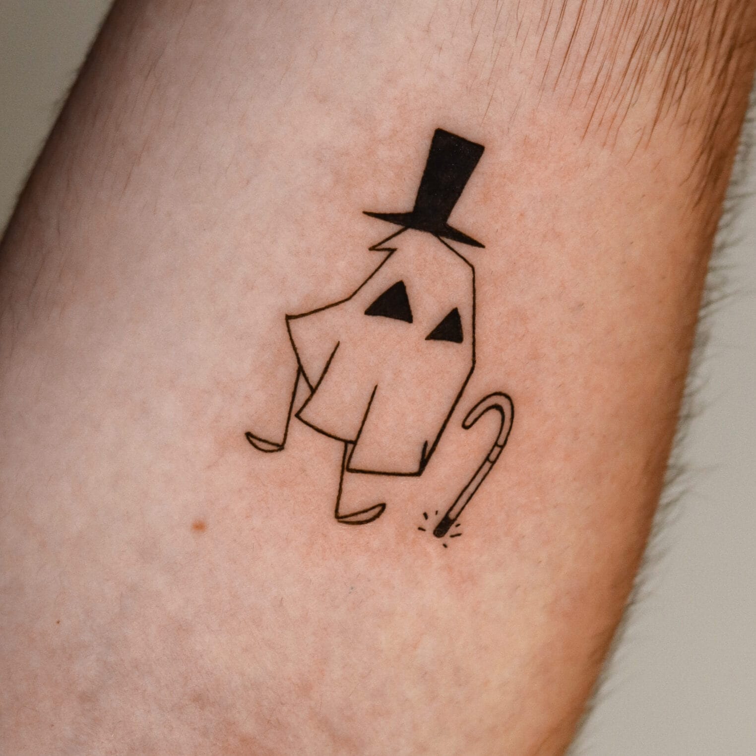 Fine Line Ghost Tattoo on Forearm