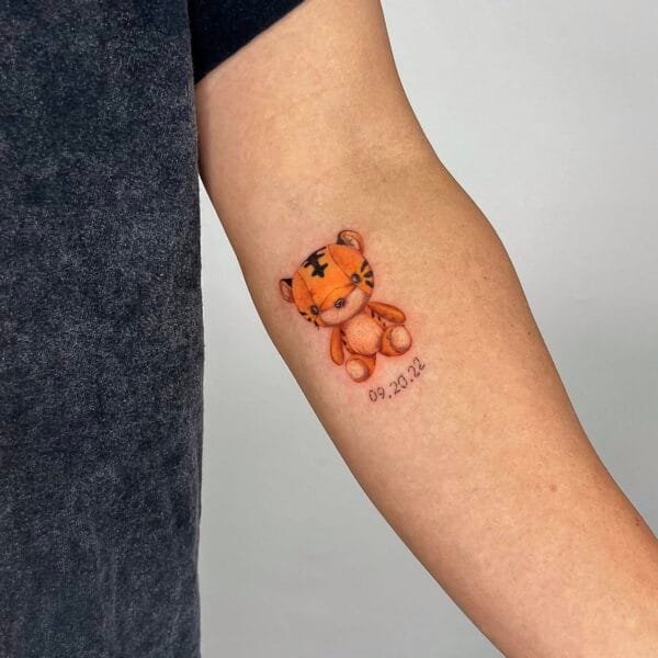 Childhood Tiger Toy Tattoo on Forearm