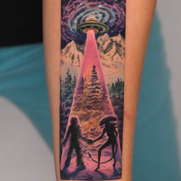 Surrealistic UFO, Bigfoot, and Alien Tattoo on Forearm