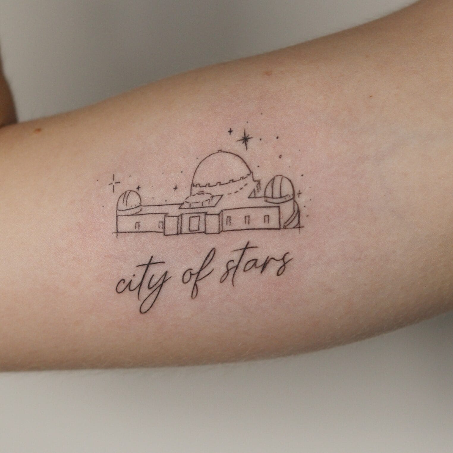 Minimalistic Griffith Observatory Tattoo on Bicep