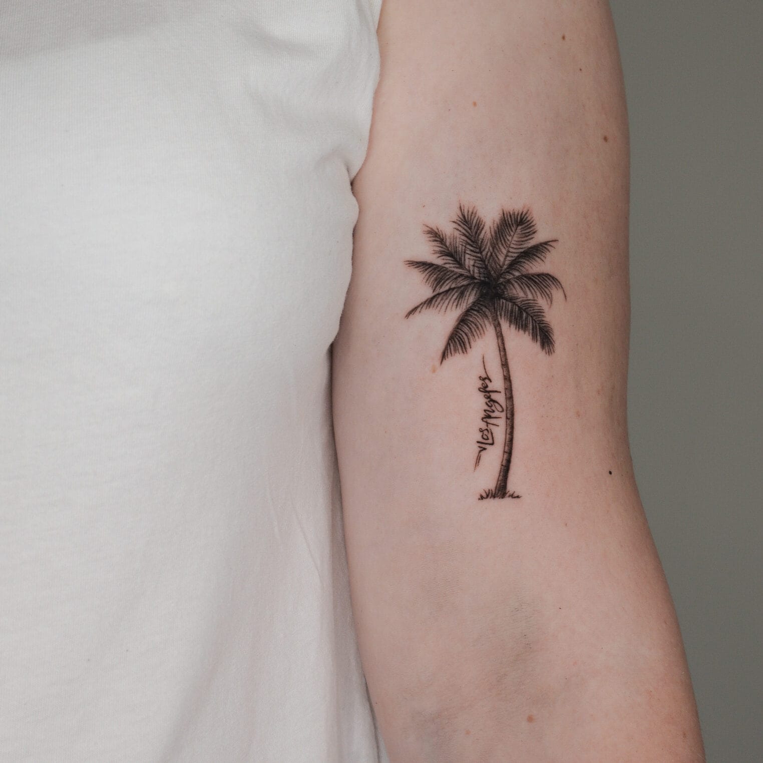 Palm Tree and Los Angeles Tattoo on Upper Arm