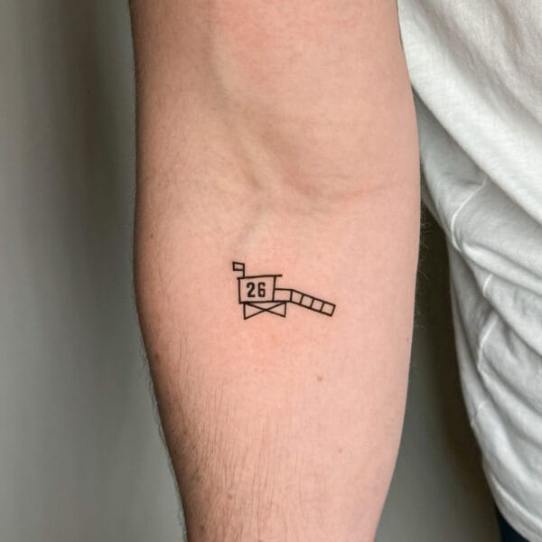 Tiny Lifeguard Tower Tattoo on Forearm