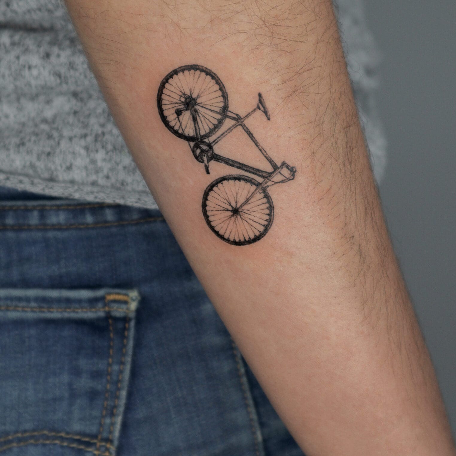Small Realistic Bicycle Tattoo on Forearm