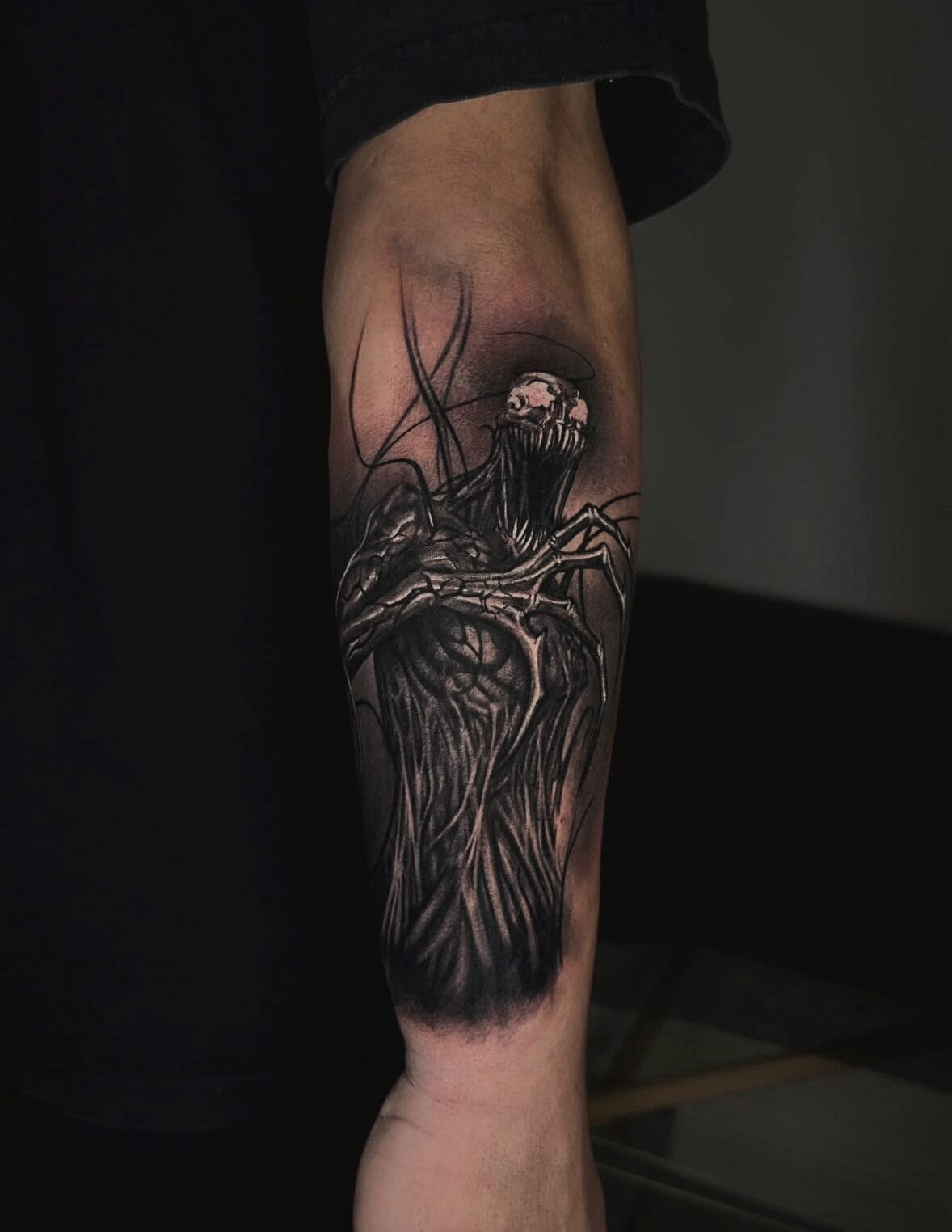 Dark Realism Venom Tattoo On Forearm