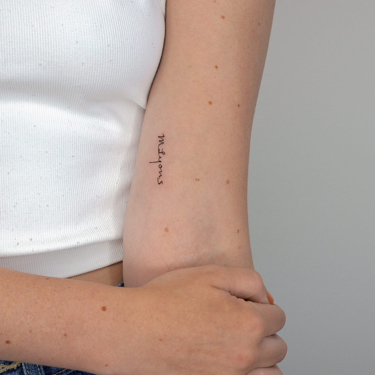 Fine Line Handwritten Tattoo on Upper Arm