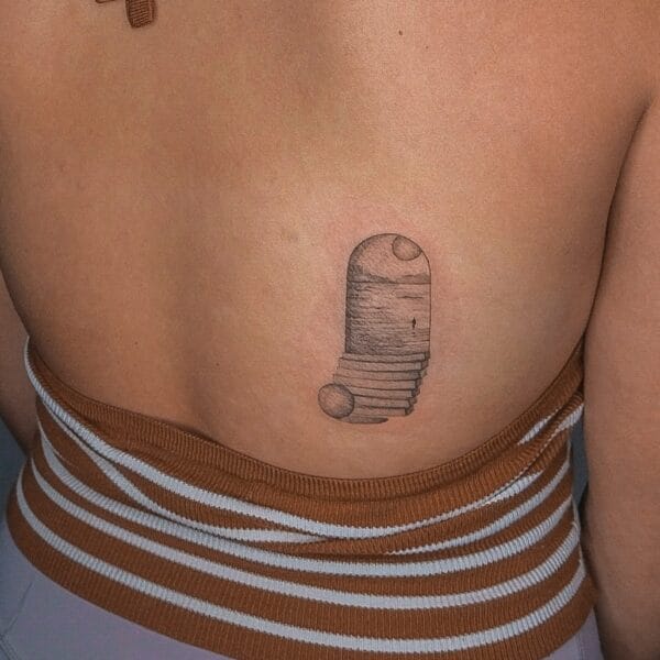 Surreal Coastal View Tattoo on Lower Back