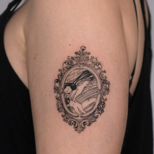 Framed Picture Tattoo on Upper Arm