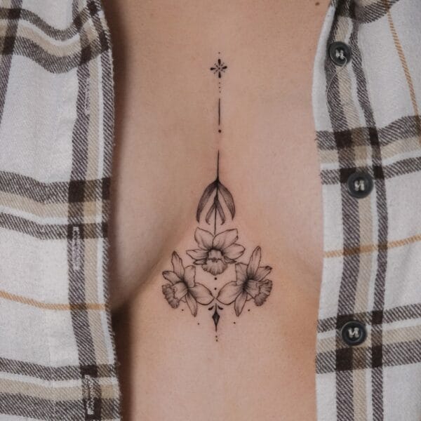 Sternum Tattoo of Delicate Narcissus Flowers