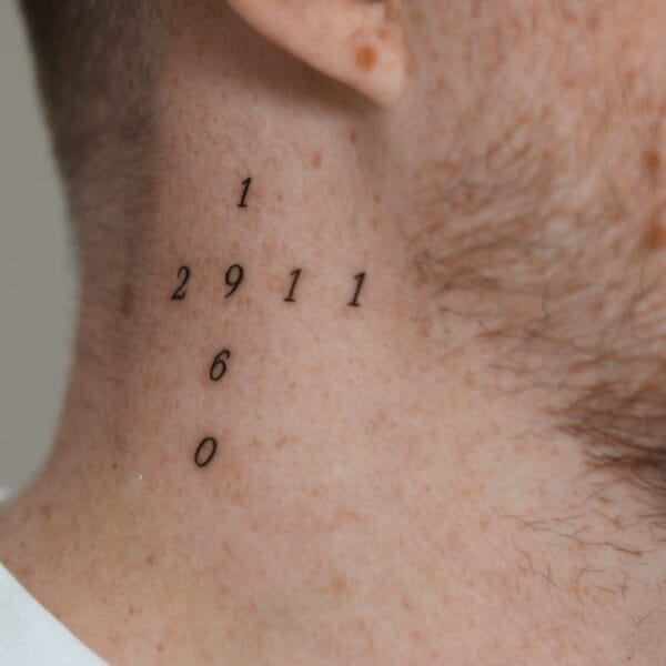 Tiny Tattoo on Neck
