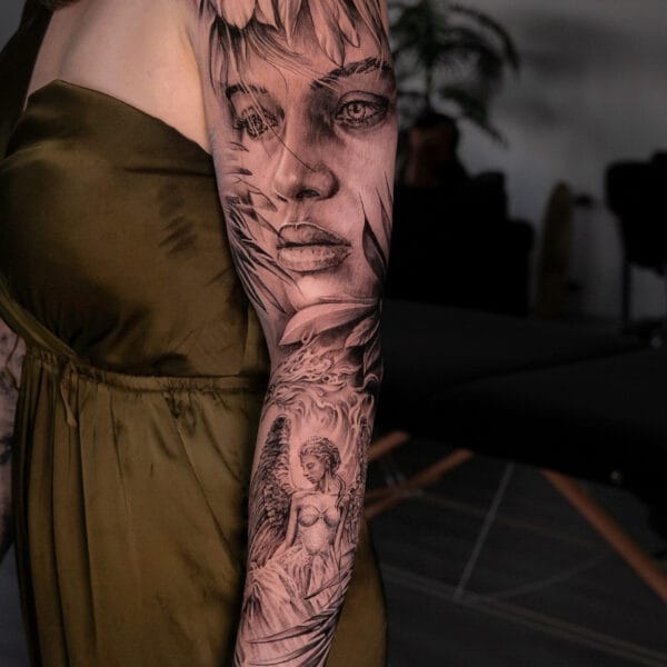 Sleeve Tattoo With Woman Face And Feathers
