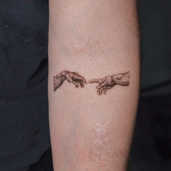 The Creation of Adam Tattoo on Arm