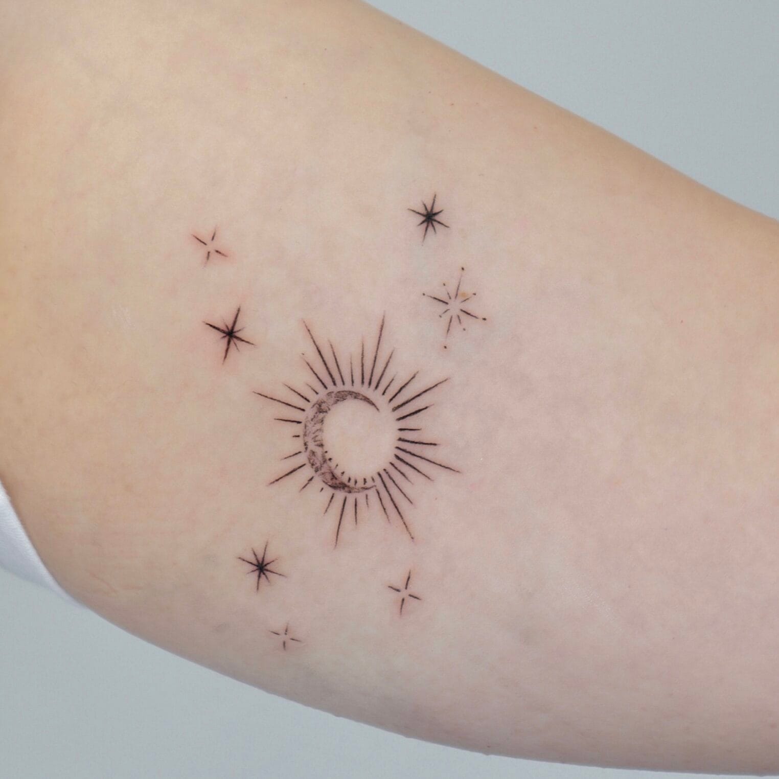 Sun and Moon Tattoo on Inner Bicep