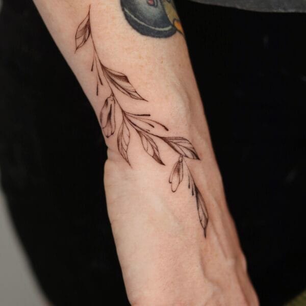 Side Hand Tattoo of Delicate Leaves