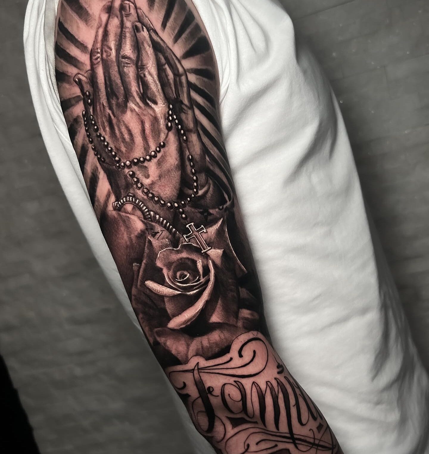 Sleeve Tattoo of Praying Hands, Cross, and Roses