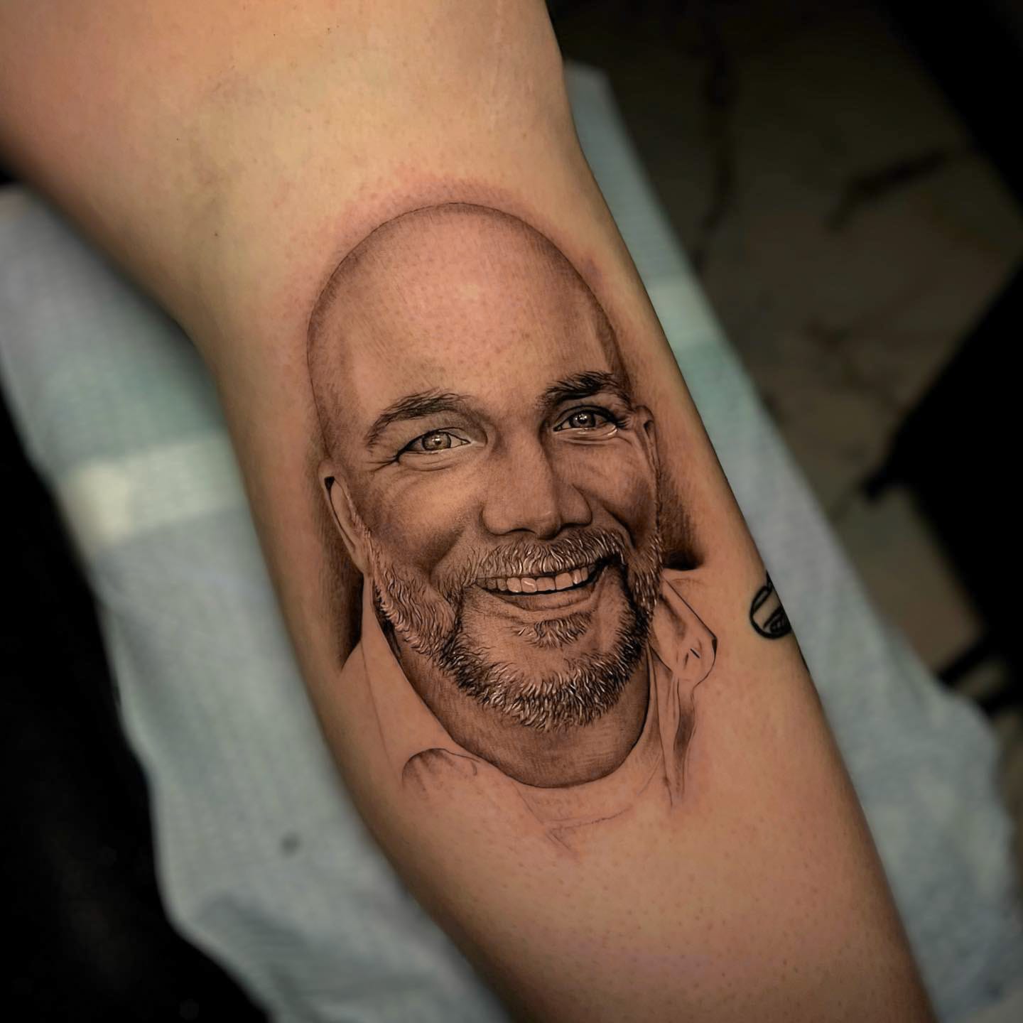 Black and Gray Portrait Tattoo on Lower Leg