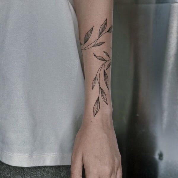 Minimalistic Leaves Branch Tattoo on Forearm