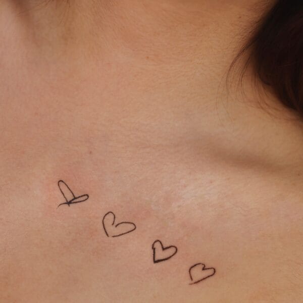 Hand Drawn Hearts Tattoo on Collarbone