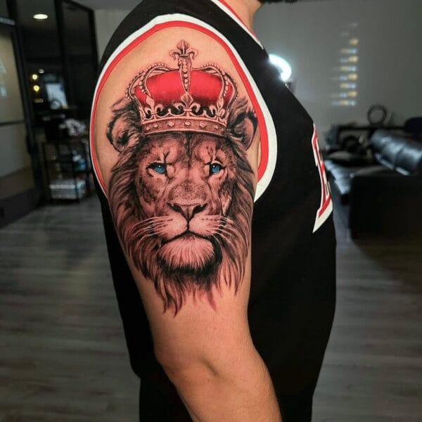 Lion with Crown Tattoo on Upper Arm