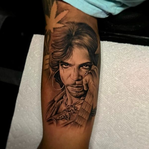 Iconic Prince Portrait Tattoo on Forearm