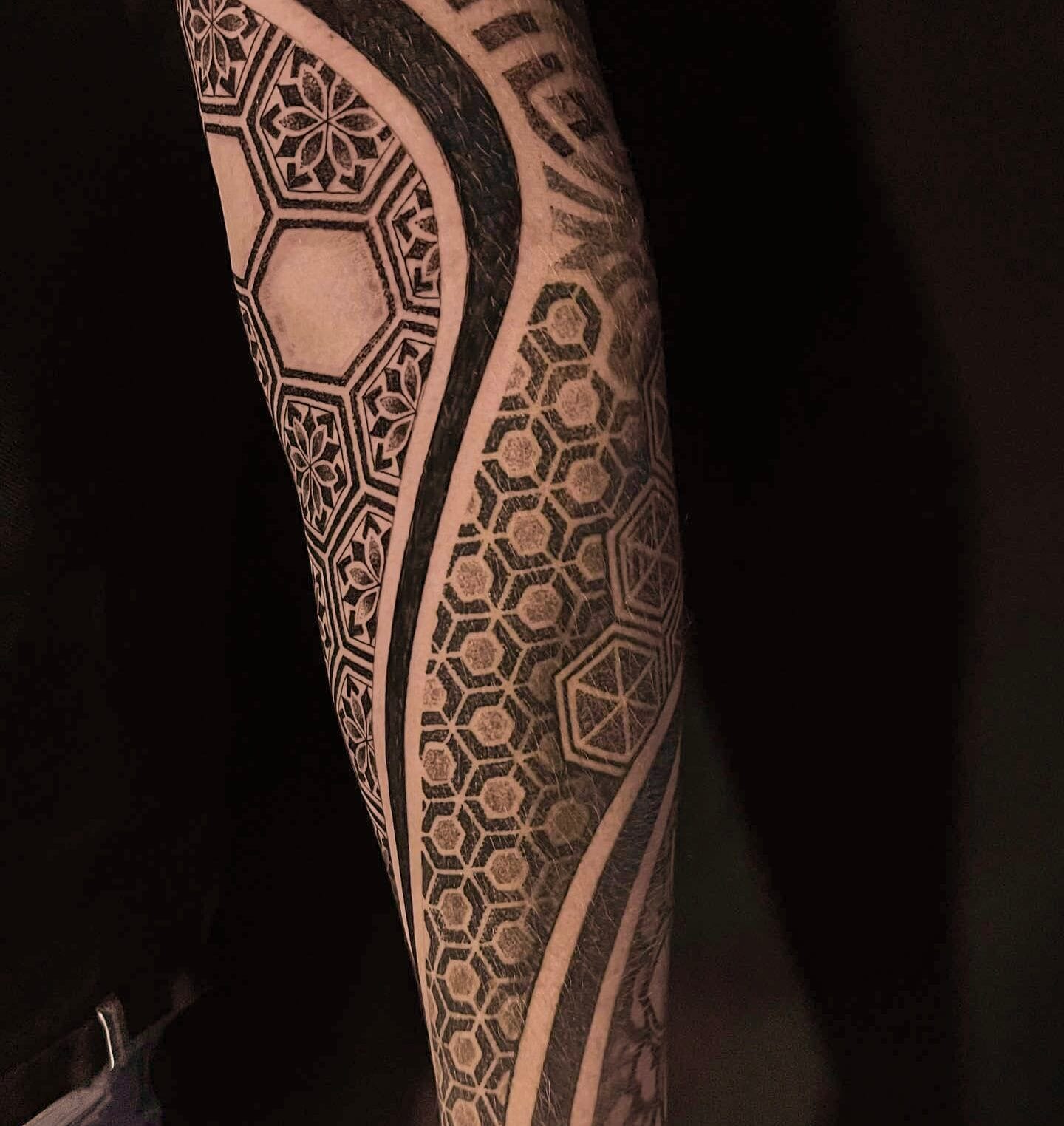 Geometric Tattoo on Arm Designed with Body Flow Precision