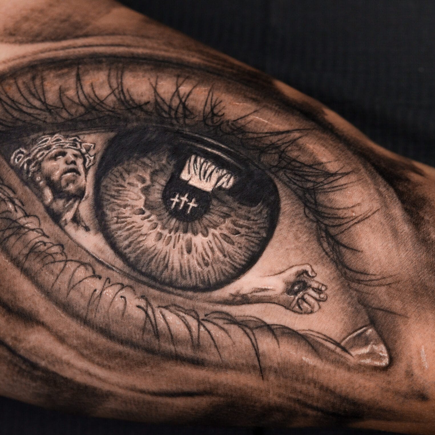 Bicep Eye Tattoo with Jesus