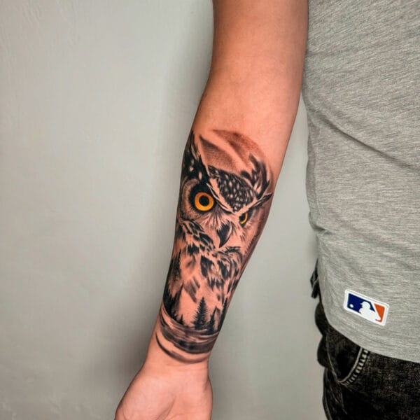 Owl Tattoo with Nature Elements on Forearm