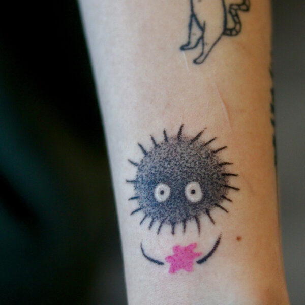 Soot Sprite Tattoo on Forearm