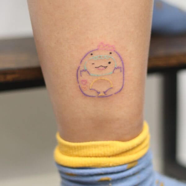 Cute Dinosaur Tattoo on Lower Leg