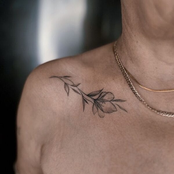 Minimalistic Flower Tattoo on Collarbone