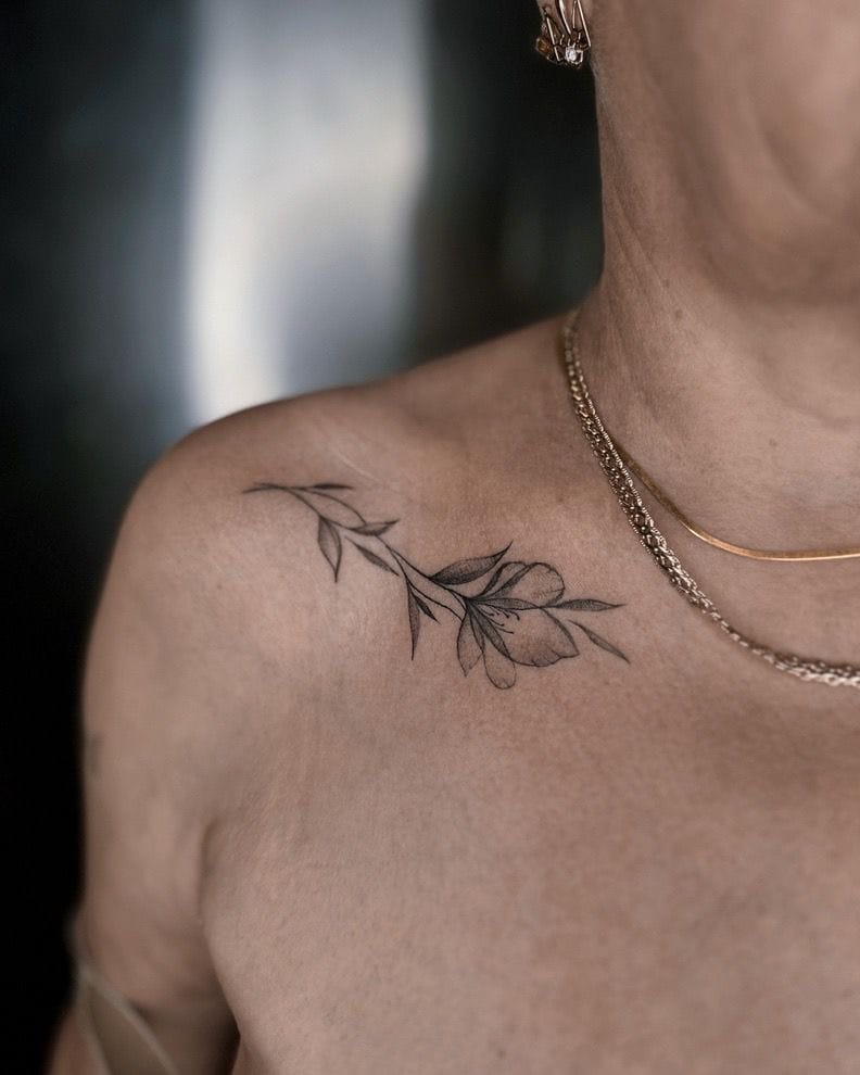 Minimalistic Flower Tattoo on Collarbone