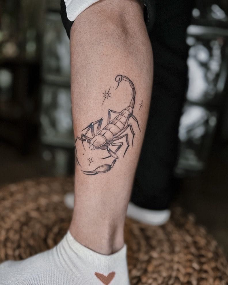 Minimalistic Scorpion Tattoo on Lower Leg