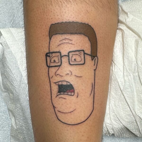 King of the Hill Tattoo on Leg