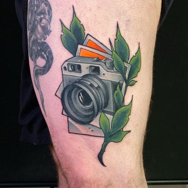 Photography Passion Tattoo of Camera on Leg