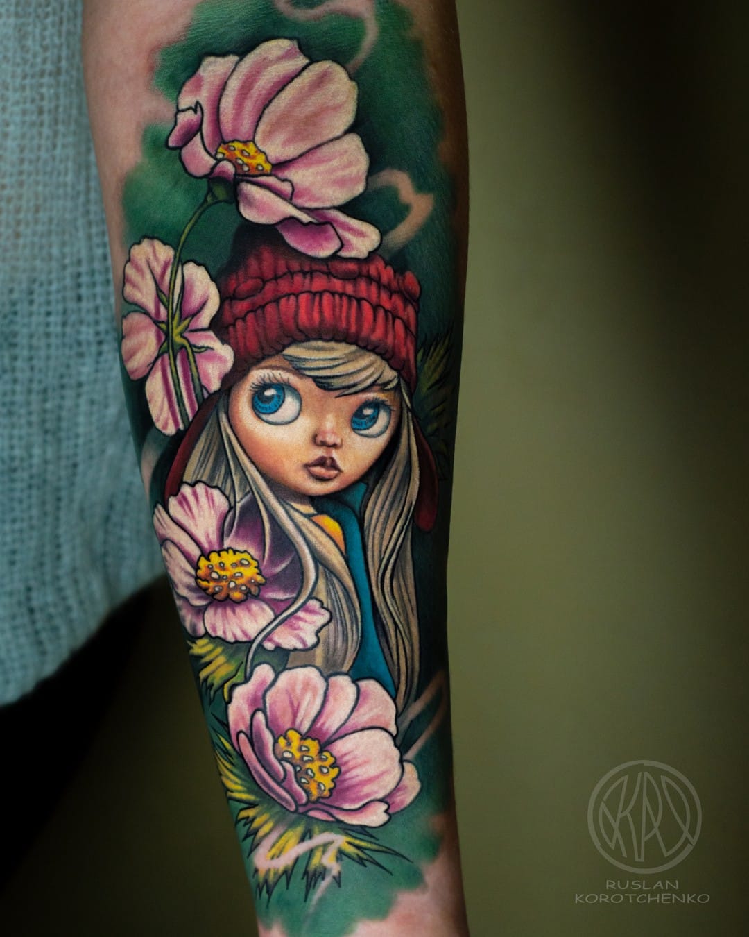Doll Tattoo on Forearm with Flowers