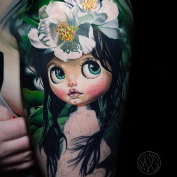 Realistic Girl Doll Tattoo on Upper Arm