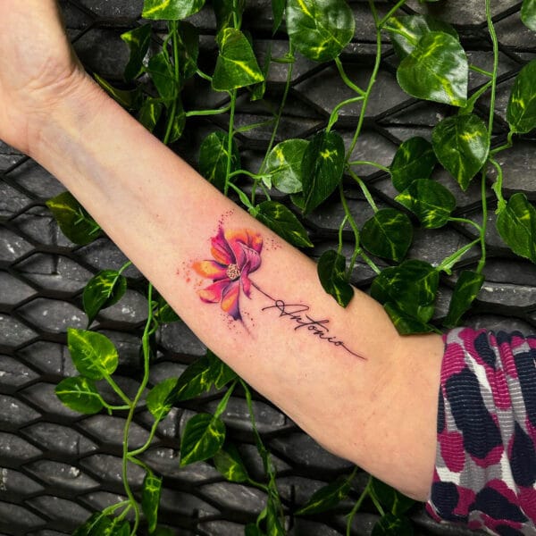 Color Flower Tattoo with Name on Stem on Forearm