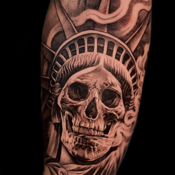 Skull Tattoo and Statue of Liberty on Forearm