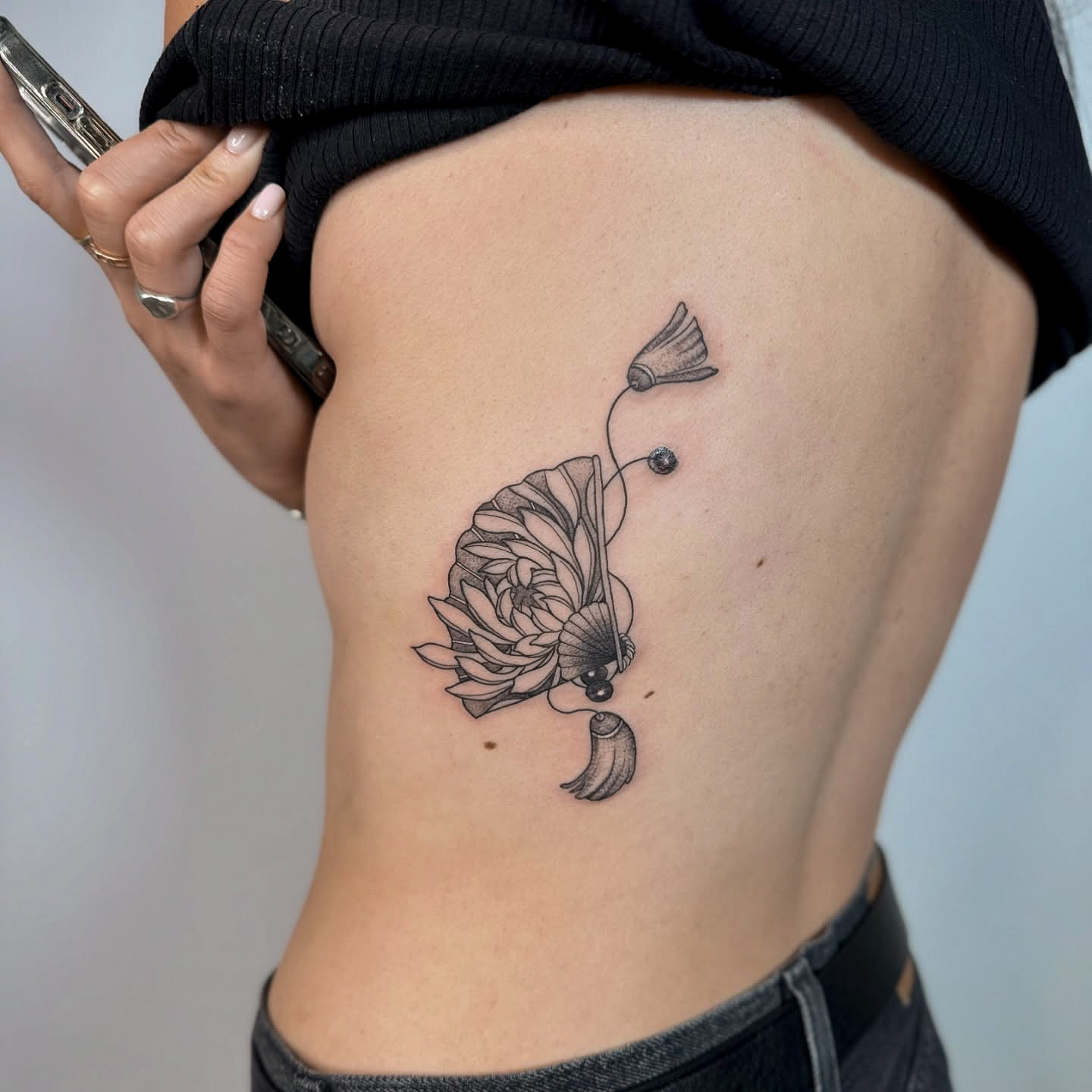 Black and Gray Fan with Flowers Side Body Tattoo