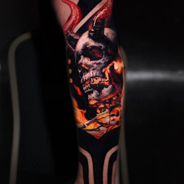 Skull with Horns Tattoo in Color Realism on Lower Leg