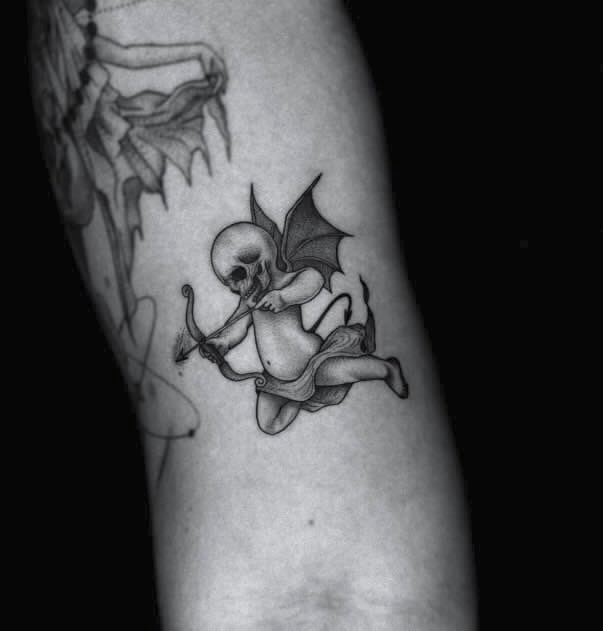 Fine Line Evil Cherub Tattoo on Arm