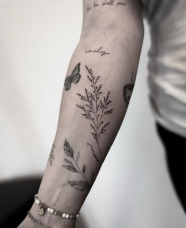 Elegant Branch Tattoo with Lettering on Forearm