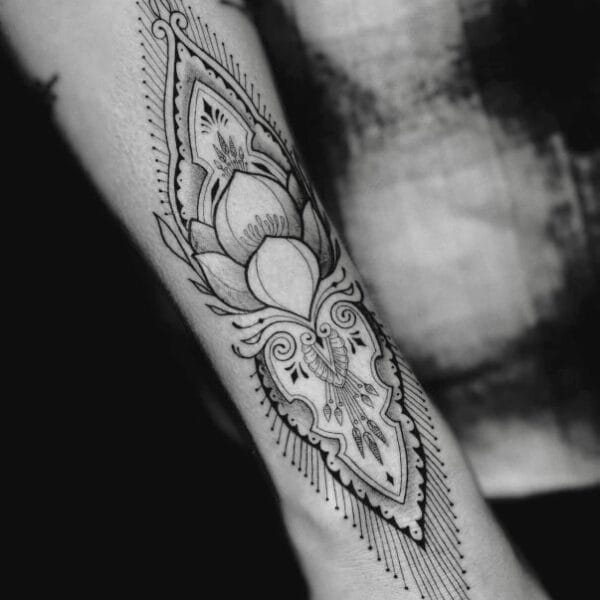 Elegant Ornamental Tattoo Design on Forearm