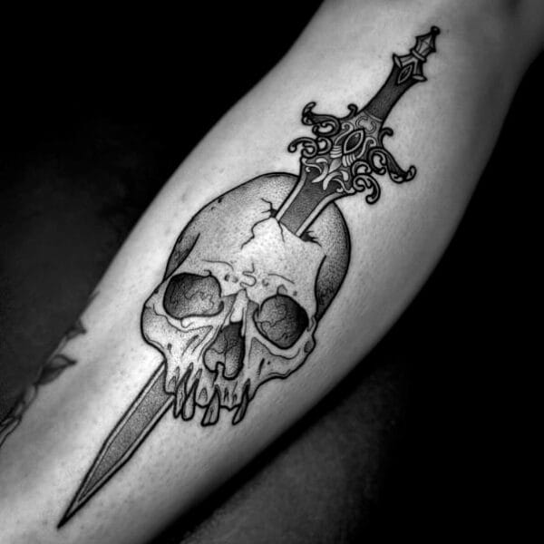 Sword Through Skull Tattoo on Lower Leg