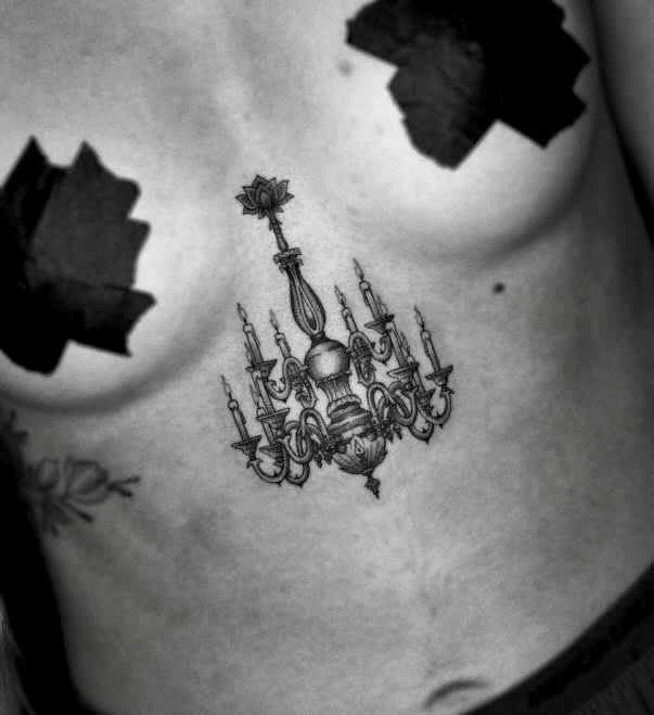 Elegant Black and Gray Chandelier Tattoo on Sternum