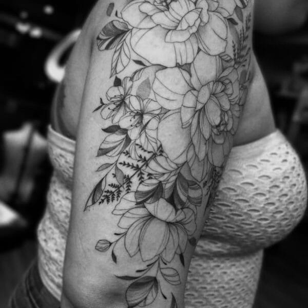 Elegant Floral Tattoo in Fine Line Style on Shoulder