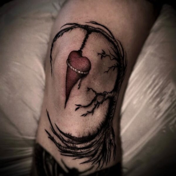 Colored Heart Hanging from Tree Tattoo around Knee