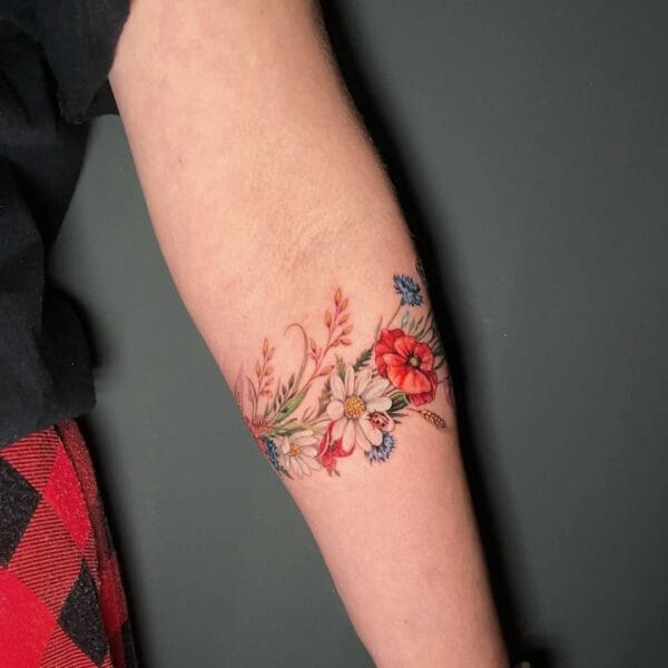 Gently Colored Flower Bracelet Tattoo on Forearm