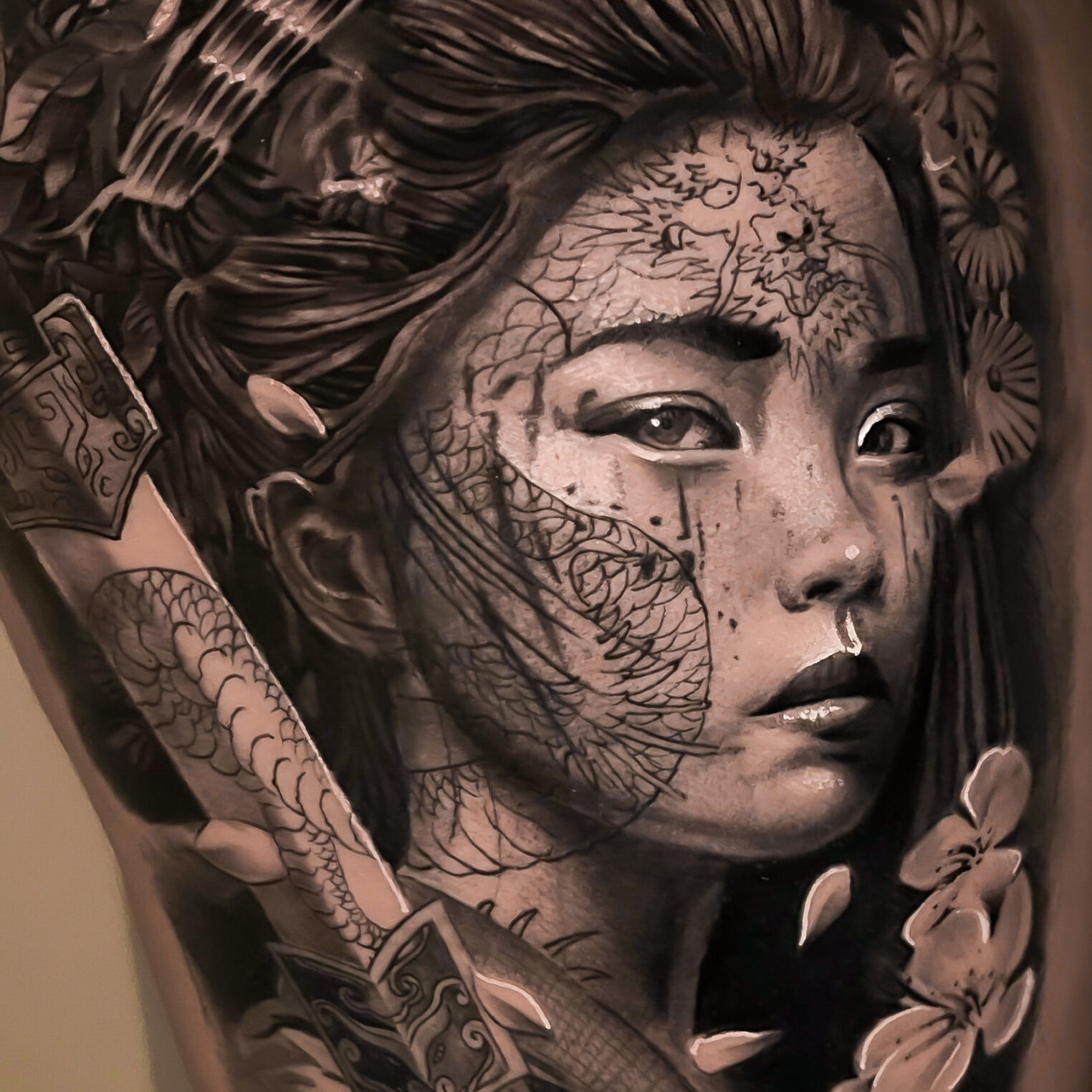 Woman with Sakura Portrait Tattoo on Leg