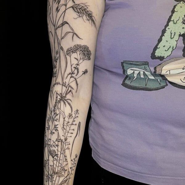 Nature Inspired Fine Line Sleeve Tattoo in Black and Gray